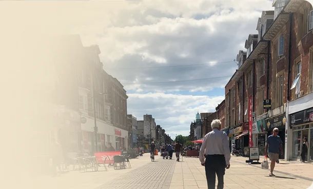 Shoppers on a pedestrianised town centre high street